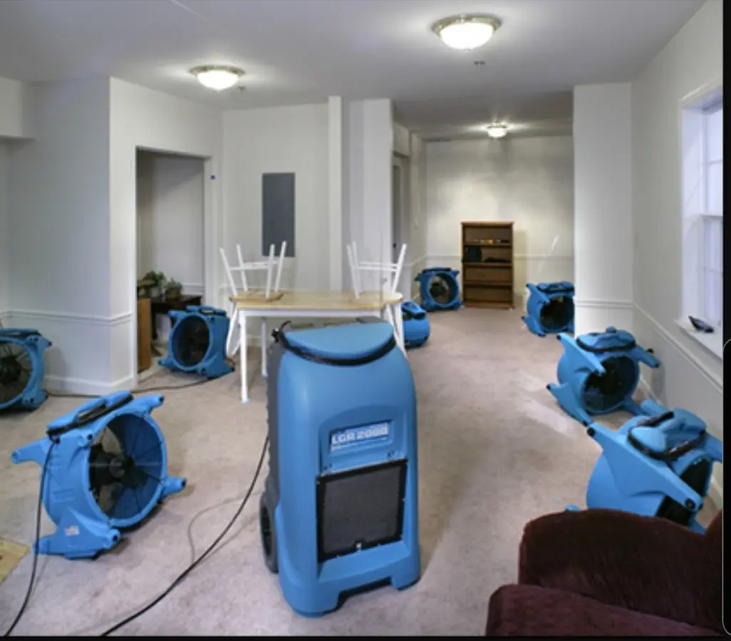 Air movers and dehumidifier setup for Water Damage Restoration in Town and Country